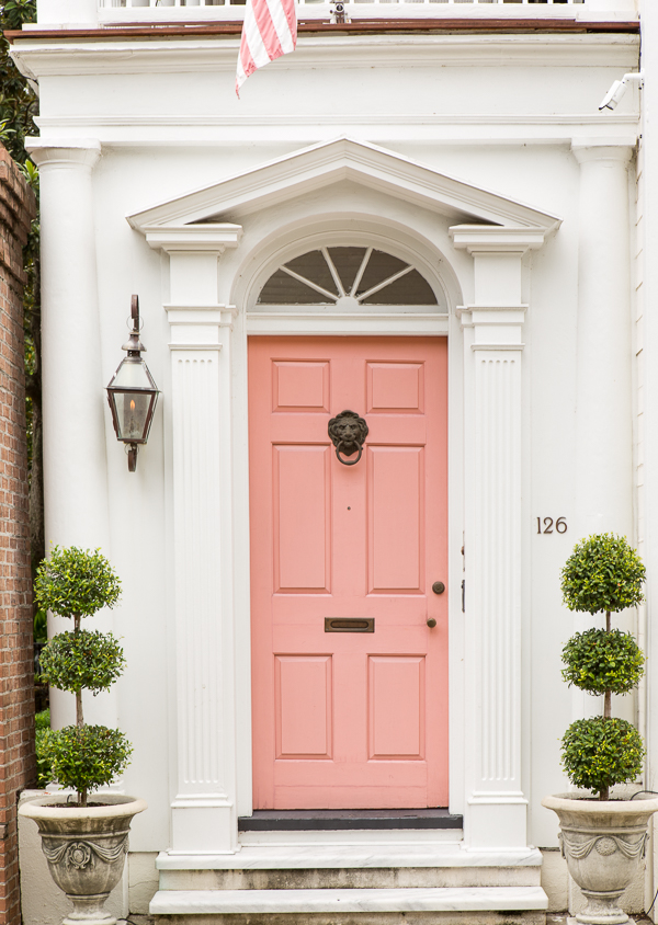 Iconic white house with pink door in Charleston