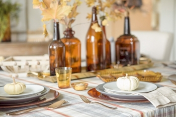 fall table with amber bottles